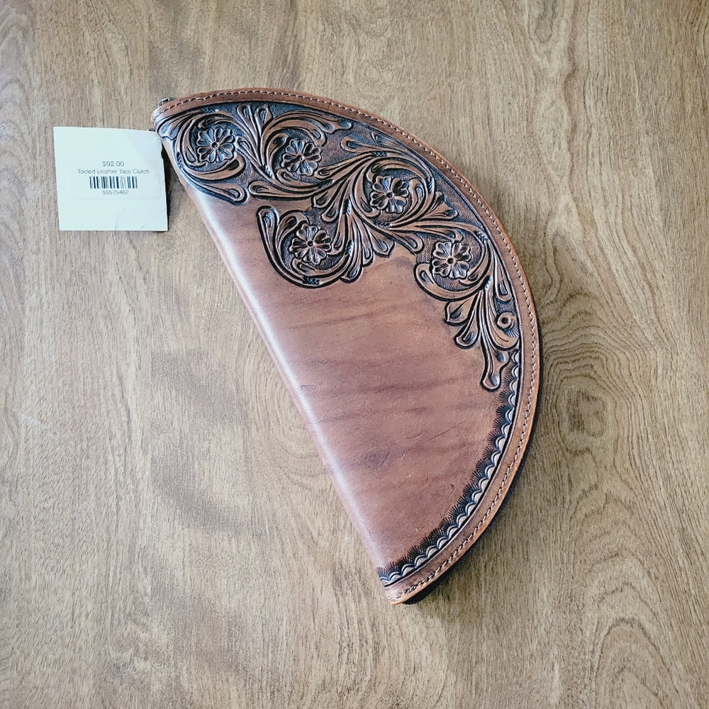 Brand new, still with tags! Genuine tooled leather taco clutch.